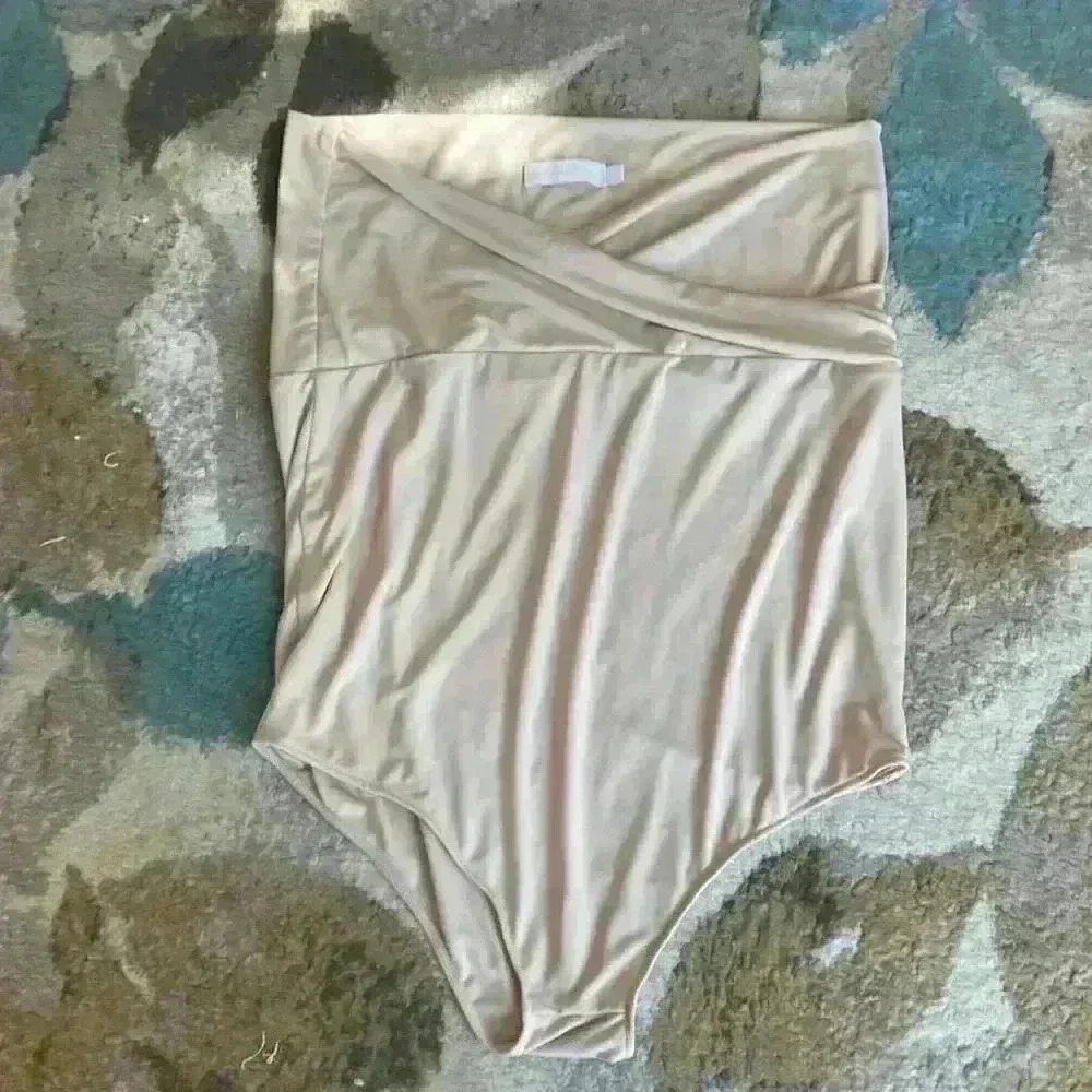 Strapless, criss cross top body suit